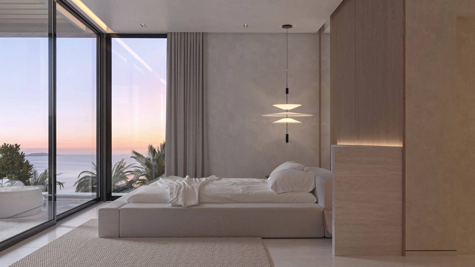 Et roligt og stilfuldt soveværelse med direkte adgang til en privat terrasse gennem store glasdøre.