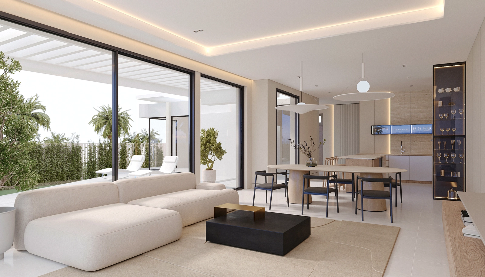 Det lyse, åbne opholds- og spiseområde forbinder problemfrit til udendørs terrassen.