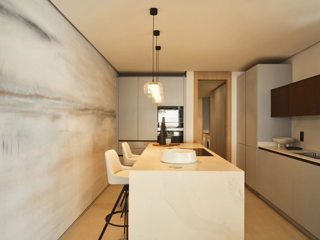 Et topmoderne køkken med avancerede hvidevarer og et minimalistisk design, perfekt til daglig brug og underholdning.