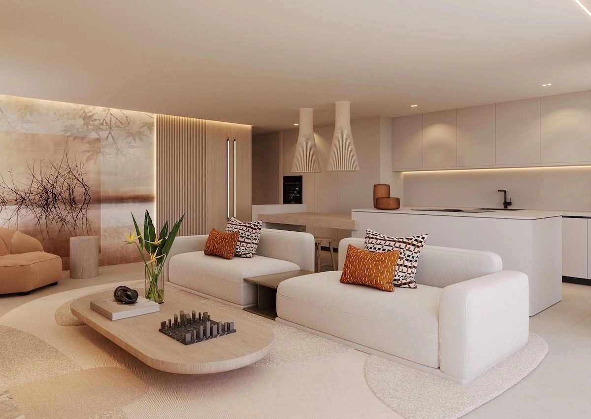 Et elegant, moderne køkken udstyret med high-end hvidevarer, sømløst integreret i opholds- og spiseområderne.