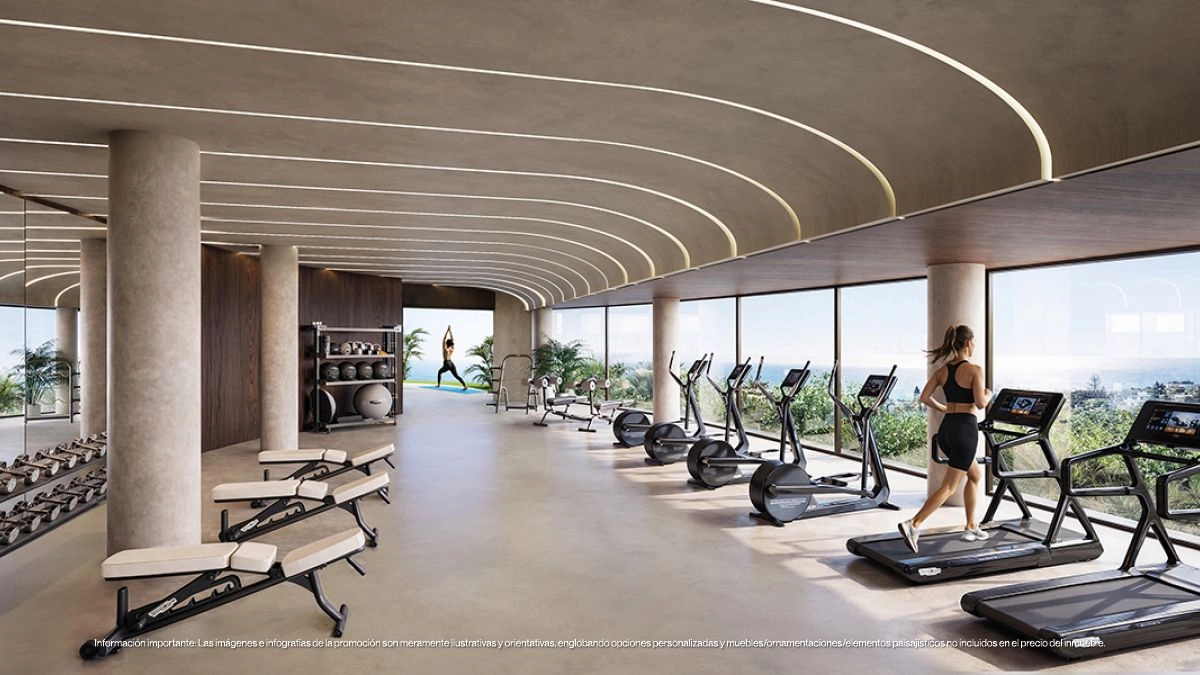 Det topmoderne fitnesscenter er fuldt udstyret og har store vinduer med inspirerende udsigt til at forbedre din træning.