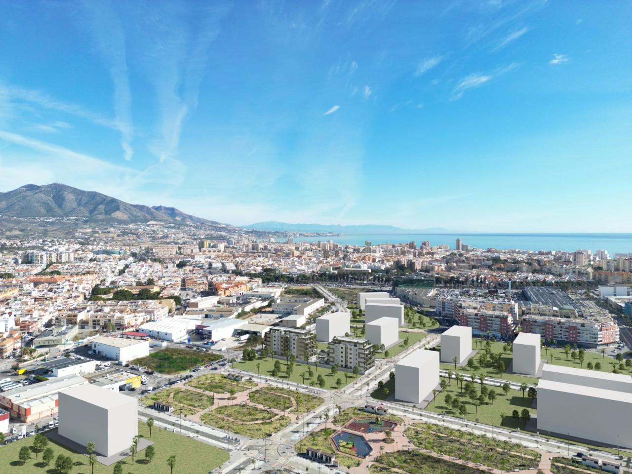 En luftfoto af boligprojektet, der fremhæver dets førsteklasses beliggenhed nær havet i Fuengirola.