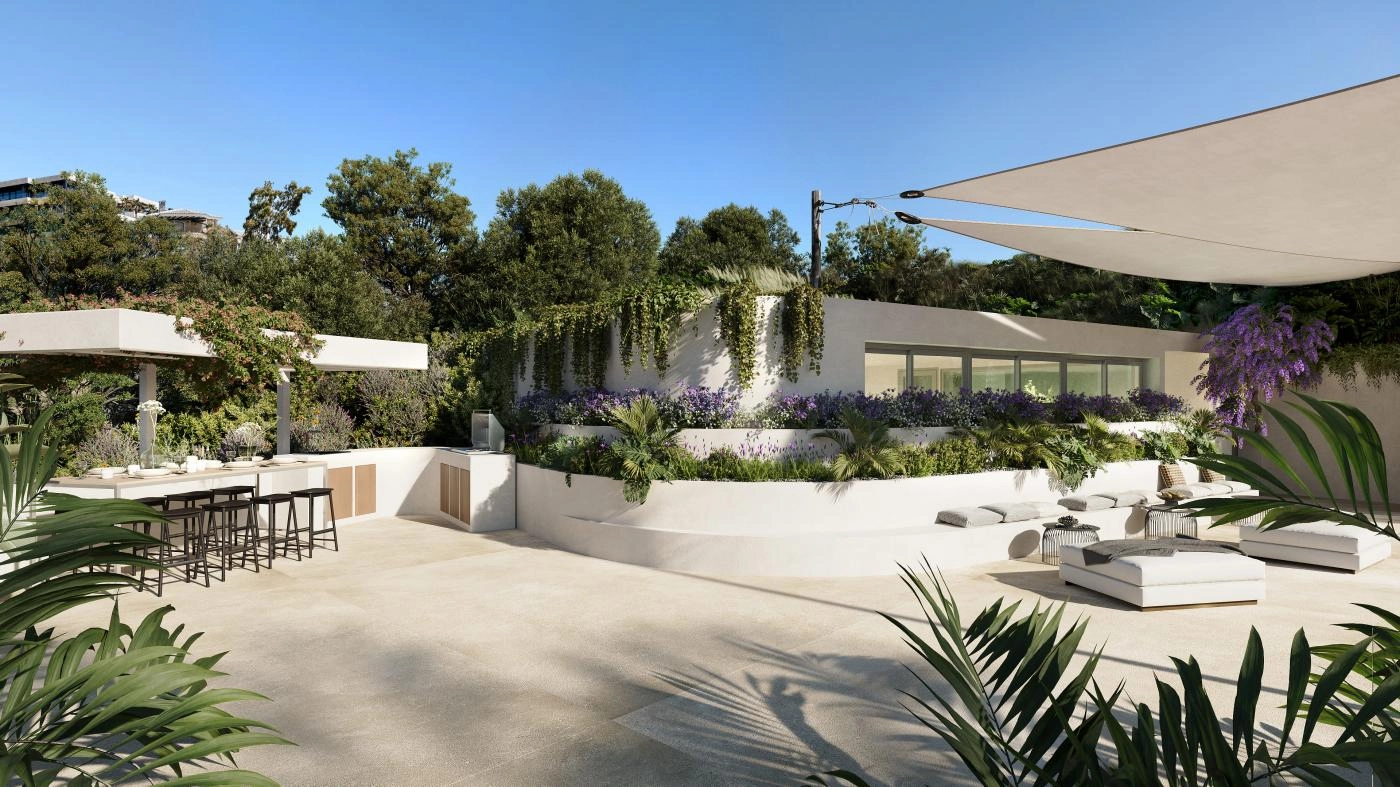 Et udendørs loungeområde og køkken med grillplads, perfekt til sociale sammenkomster og udendørs spisning.