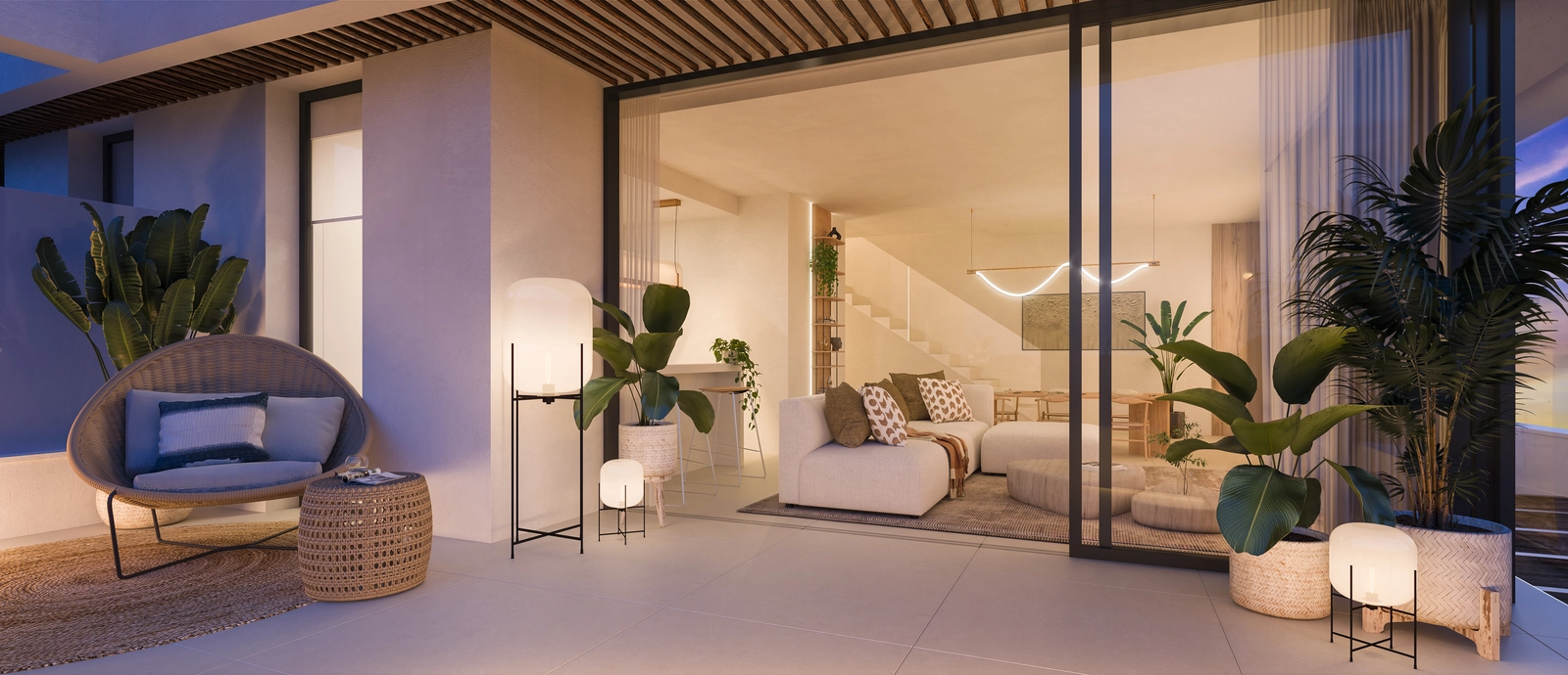 Et elegant opholdsrum, der åbner op til en rummelig terrasse for en flydende overgang mellem inde- og udeliv.