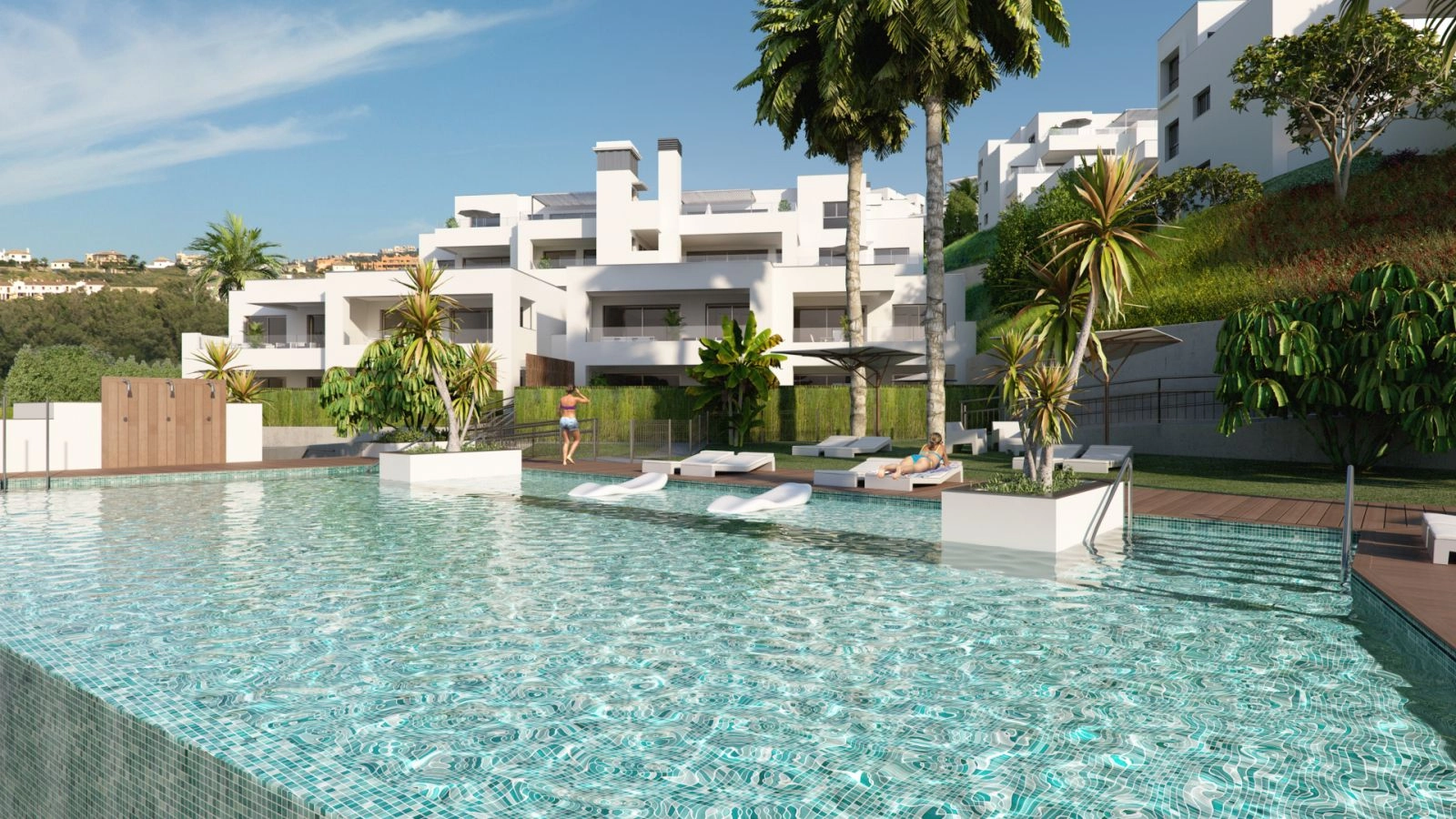 Slap af ved en af designer-swimmingpoolene, anlagt i smukke landskabshaver.