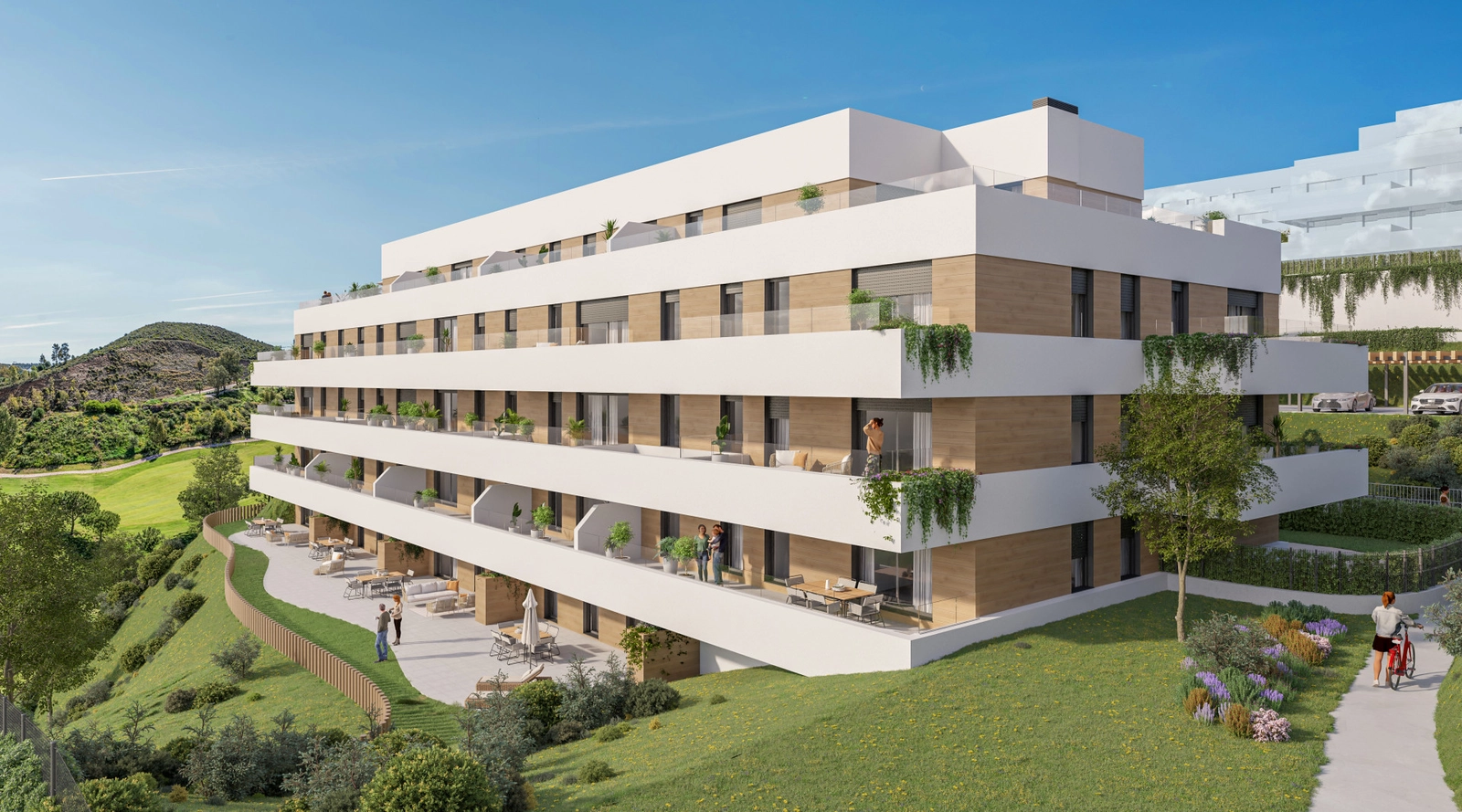 Boligernes moderne arkitektur, med udsigt over golfbanens frodige gr
nne landskab.