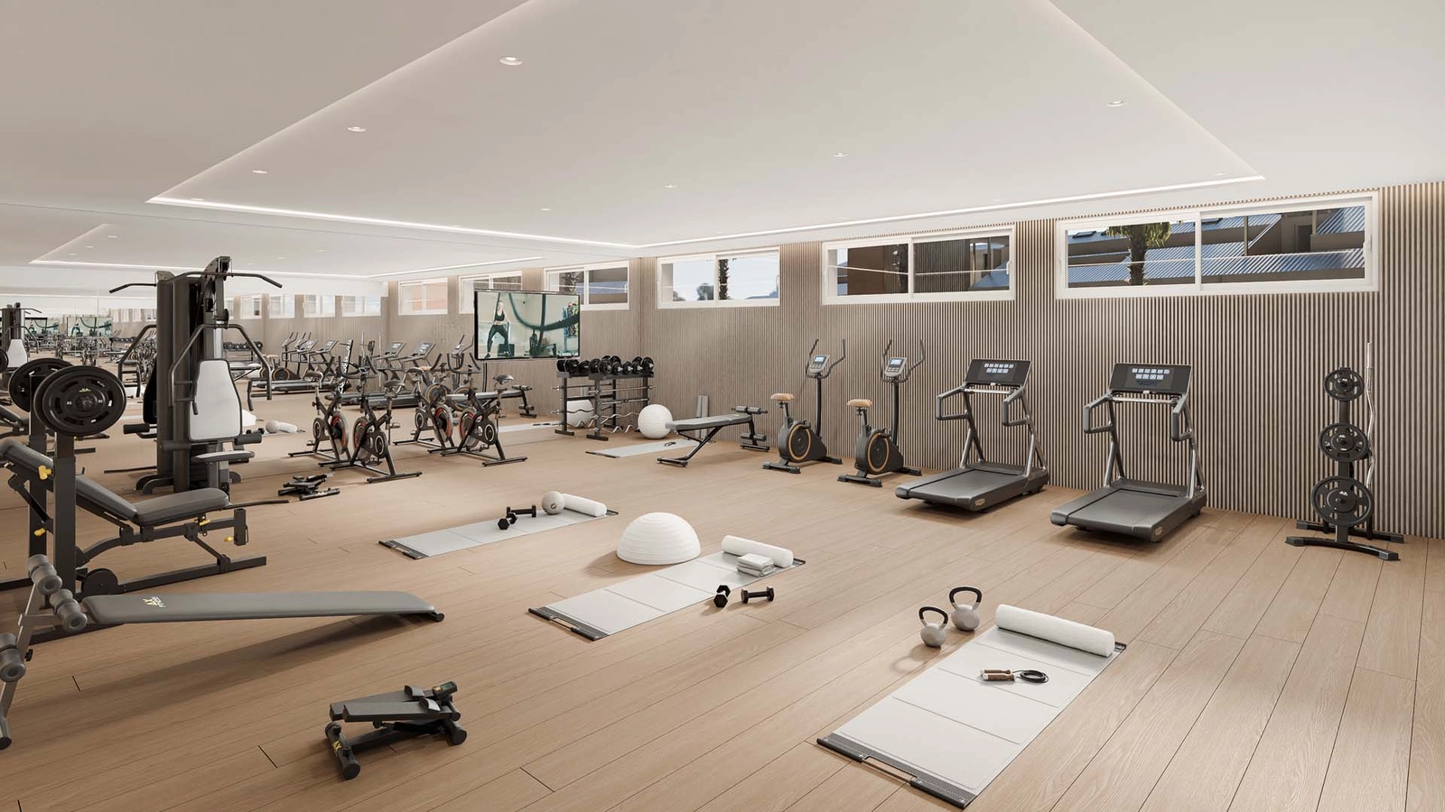 Et fuldt udstyret, topmoderne fitnessrum til beboernes fitness og velvære.