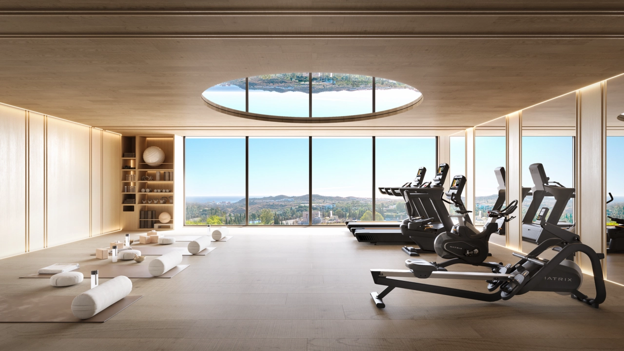 Det topmoderne fitnesscenter og wellnessområde, der tilbyder inspirerende udsigt, mens du træner.