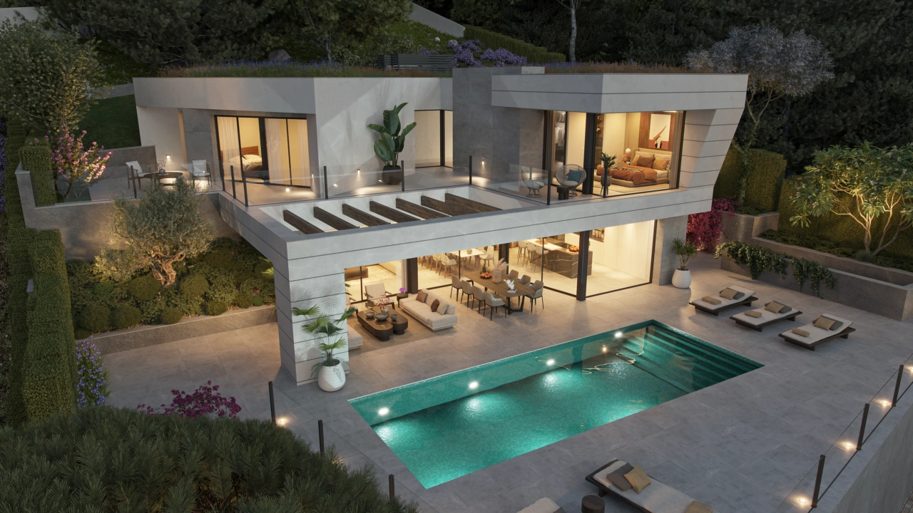 Et aftenbillede af villaen, hvor elegant belysning skaber en varm og indbydende atmosfære.