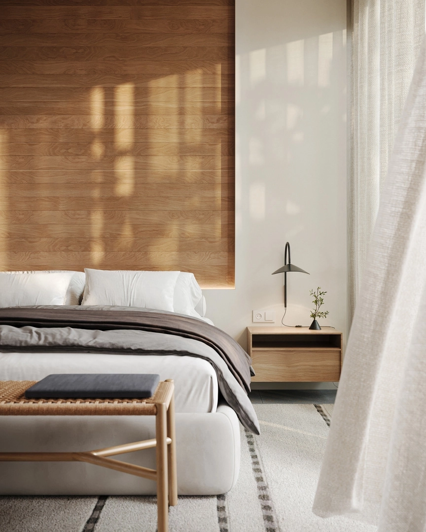 Master soveværelset er et fredfyldt tilflugtssted med naturlige materialer og store vinduer, der byder morgenlyset velkommen.