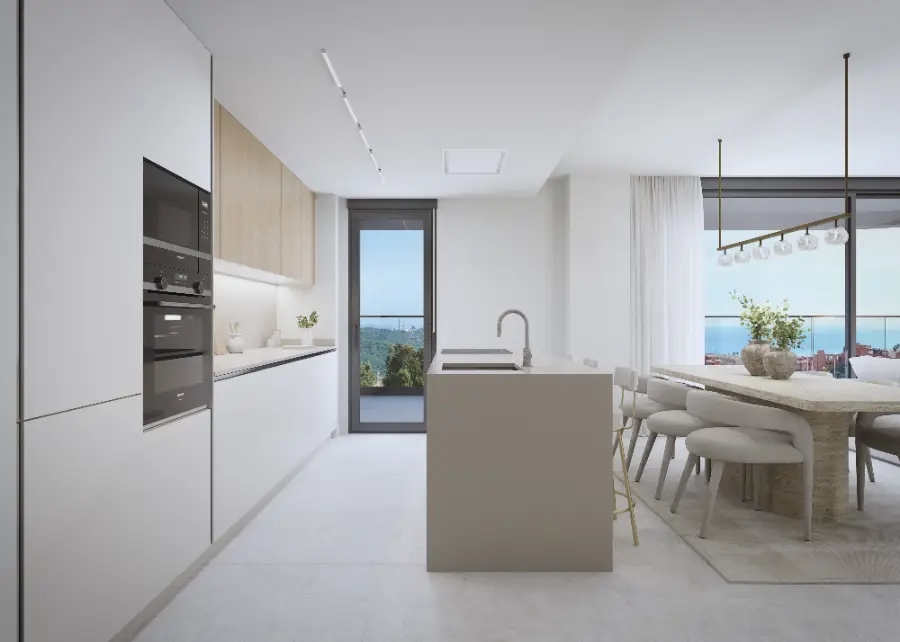 Et moderne, fuldt udstyret køkken, der flyder sammen med opholdsstuen, perfekt til underholdning.