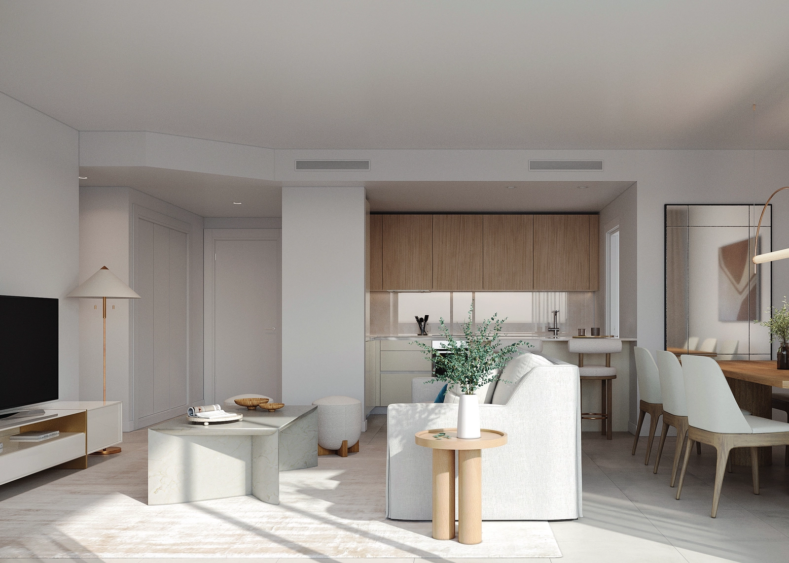 Lyse og åbne opholdsrum, der flyder problemfrit sammen, fyldt med naturligt lys.